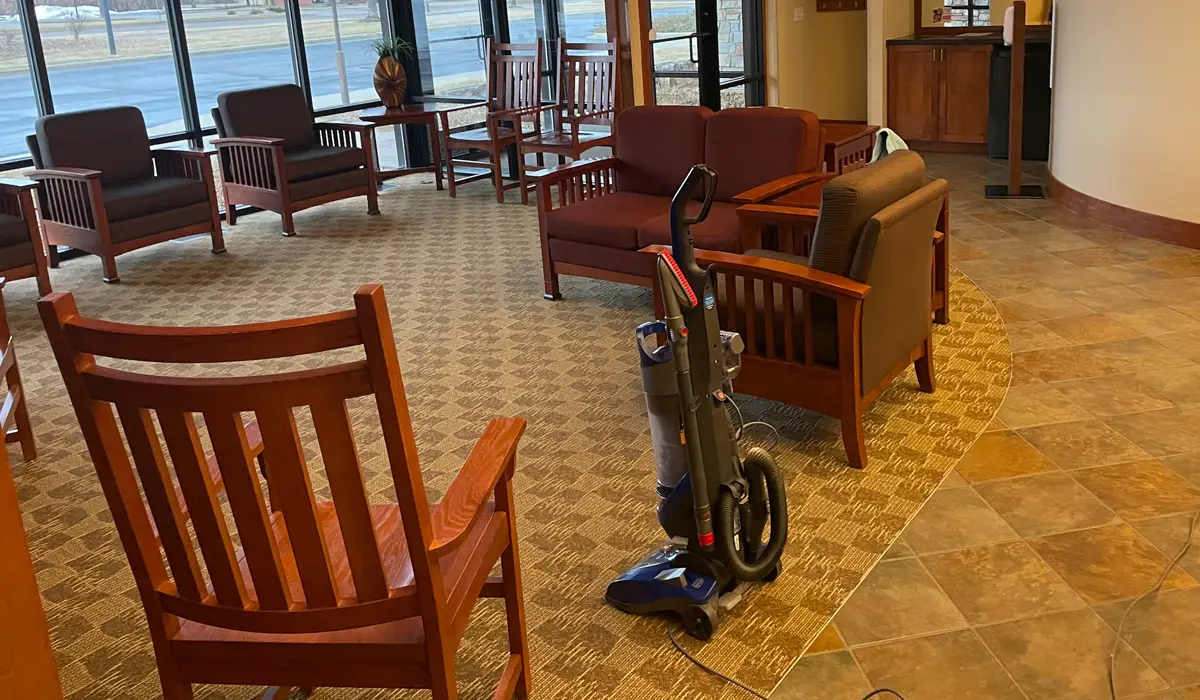 a vacuum cleaner in an office lobby area